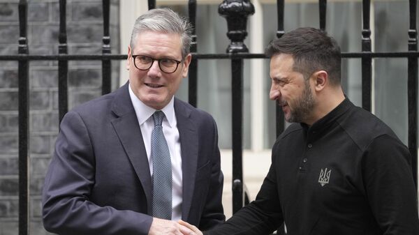 Britain's Prime Minister Keir Starmer welcomes Ukrainian President Volodymyr Zelensky to 10 Downing Street in London, Thursday, Oct. 10, 2024. - Sputnik International