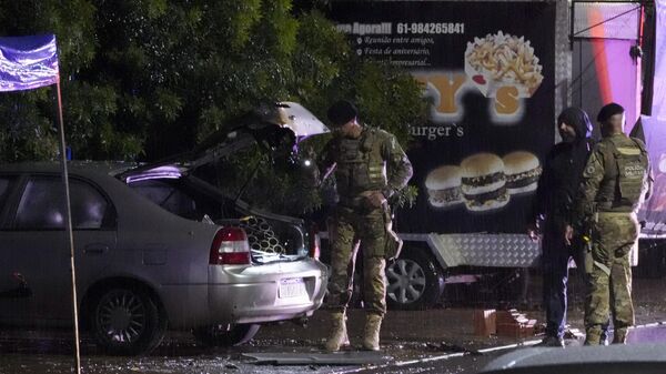 Police inspect a vehicle outside the Supreme Court in Brasília, Brazil, following an explosion, Wednesday, Nov. 13, 2024 - Sputnik International