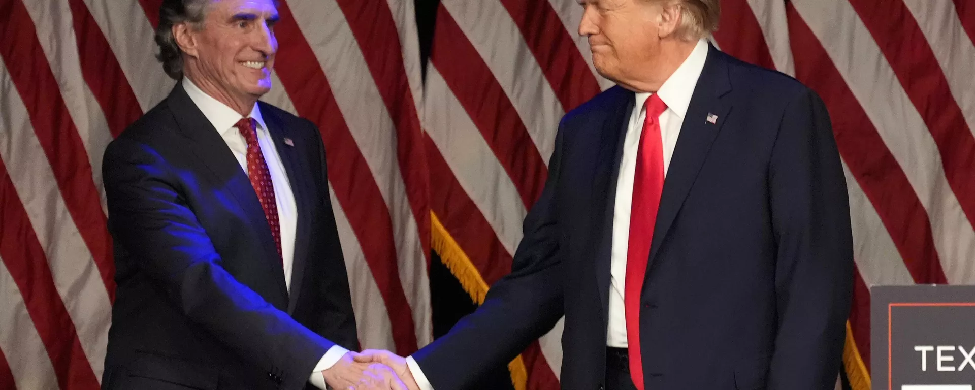 Donald Trump shakes hands with North Dakota Gov. Doug Burgum before he speaks at a caucus night rally in Las Vegas, Feb. 8, 2024.  - Sputnik International, 1920, 15.11.2024