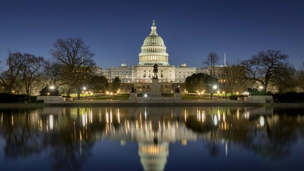 The US Capitol building is seen before sunrise on Capitol Hill in Washington, Monday, March. 21, 2022.  - Sputnik International