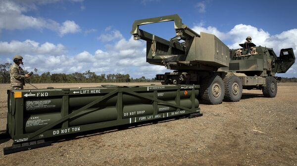 The process of preparing a crane for loading the Army Tactical Missile System (ATACMS) on to the High Mobility Artillery Rocket System (HIMARS). File photo - Sputnik International