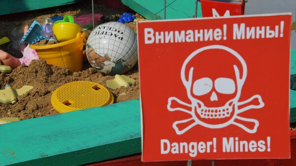 An installation shows a sandbox and PFM-1 anti-personnel landmine used by the Ukrainian Armed Forces in Donetsk - Sputnik International