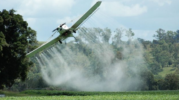 Screenshot of field being sprayed with chemicals.  - Sputnik International