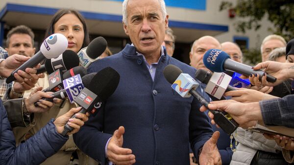 Calin Georgescu, running as an independent candidate for president, speaks to media after registering his bid in the country's presidential elections, in Bucharest, Romania, Tuesday, Oct. 1, 2024.  - Sputnik International