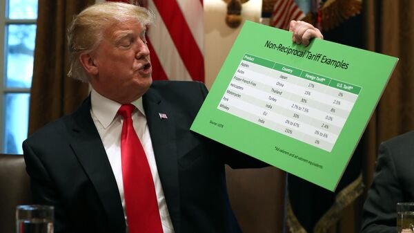 President Donald Trump holds up examples of tariffs, Thursday, Jan. 24, 2019, in the Cabinet Room of the White House in Washington. - Sputnik International