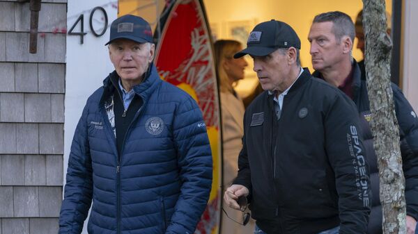 President Joe Biden and son Hunter Biden walk in downtown Nantucket Mass., Friday, Nov. 29, 2024. - Sputnik International