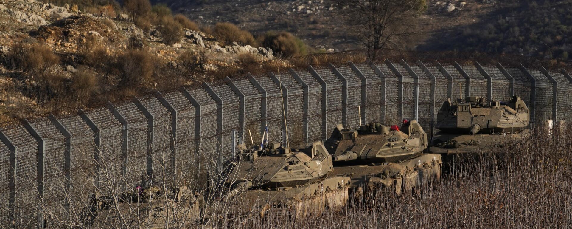 Israeli armored vehicles park along the so-called Alpha Line that separates the Israeli-annexed Golan Heights from Syria, Sunday, Dec. 8, 2024.  - Sputnik International, 1920, 09.12.2024