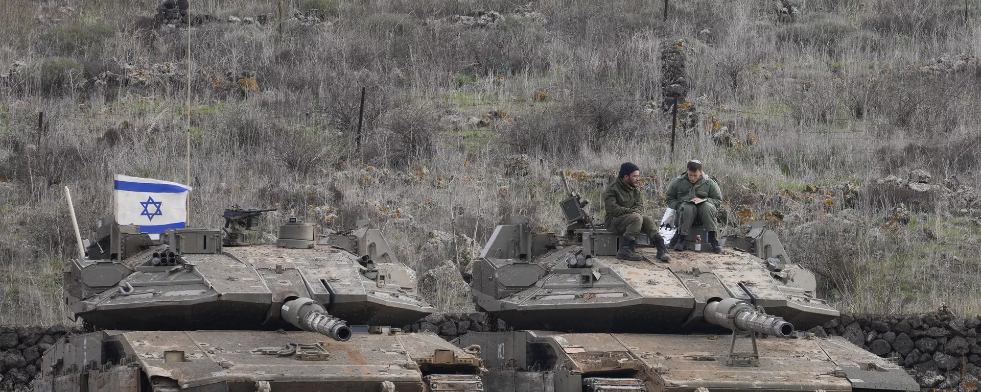 Israeli soldiers sit atop an armoured vehicle near the so-called Alpha Line that separates the Israeli-occupied Golan Heights from Syria Saturday Dec. 7, 2024.  - Sputnik International, 1920, 11.12.2024