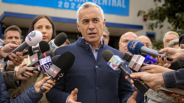 Calin Georgescu, running as an independent candidate for president, speaks to media after registering his bid in the country's presidential elections, in Bucharest, Romania, Tuesday, Oct. 1, 2024.  - Sputnik International