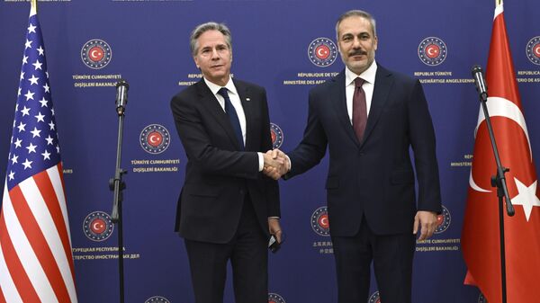 US Secretary of State Antony Blinken, left, shakes the hand of Turkish Foreign Minister Hakan Fidan after a joint press conference at the Ministry headquarters in the Turkish capital Ankara Friday, Dec. 13, 2024.  - Sputnik International