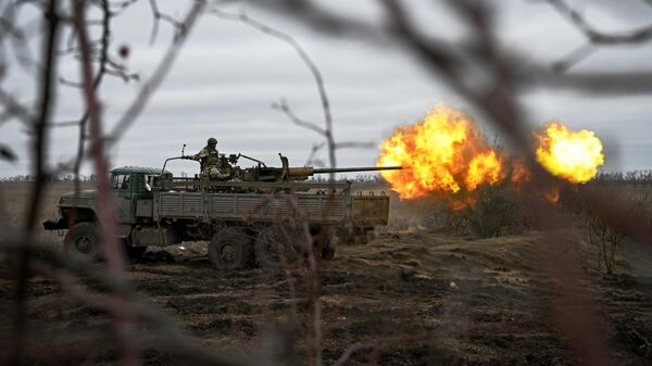 Russian servicemen fire an AZP S-60 anti-aircraft gun mounted on a Kamaz vehicle at Ukrainian positions in the Krasny Liman area. - Sputnik International