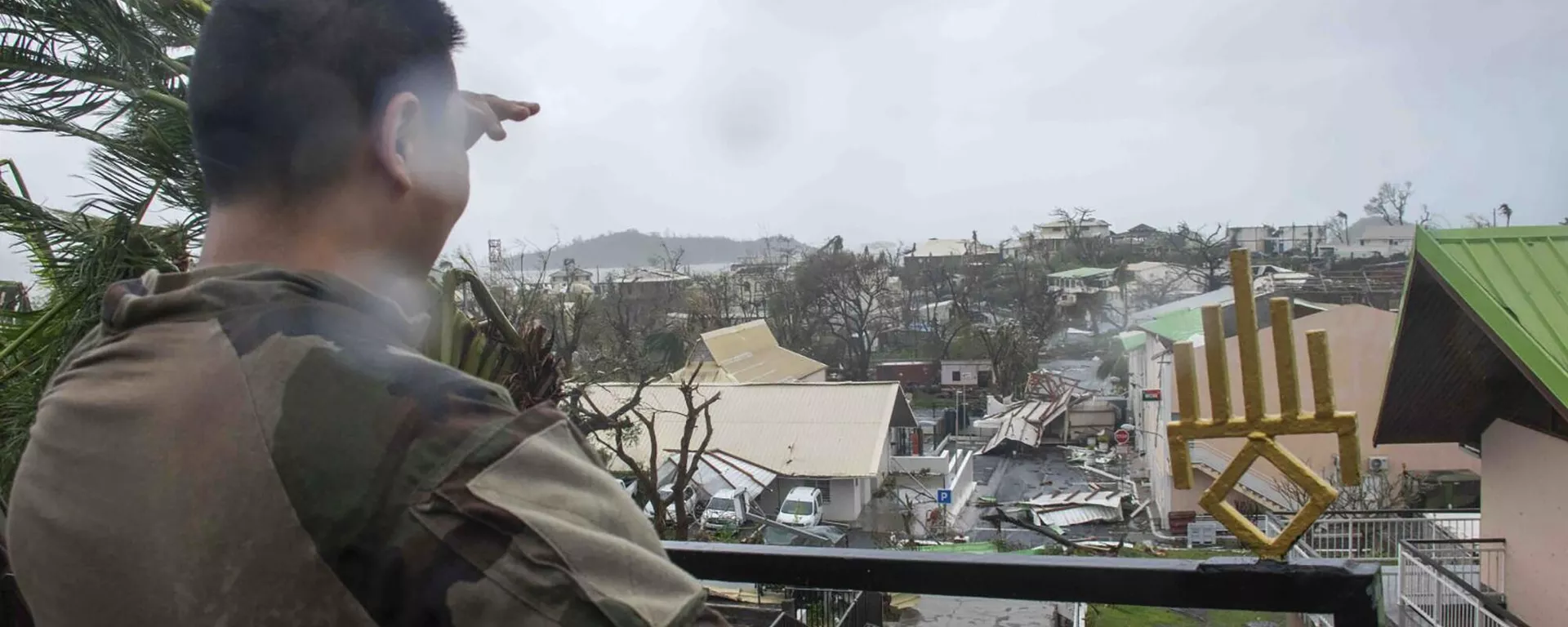 This photo provided by the French Army shows a soldier looking at damages in the French territory of Mayotte in the Indian Ocean, after Cyclone Chido caused extensive damage with reports of several fatalities.  - Sputnik International, 1920, 16.12.2024