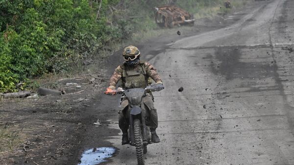 A Russian serviceman riding a motorcycle in the zone of the special military operation in Ukraine.
 - Sputnik International