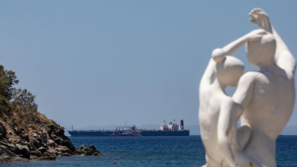 Russian-flagged tanker Lana is seen anchored off the port of Karystos, Greece. The tanker has changed ownership and its name from Pegas to Lana before entering Greek waters and was flying the Iranian flag when it was arrested on suspicion that it was avoiding EU sanctions. The US claimed that the vessel was carrying Iranian crude, subject to US sanctions, and requested that the cargo be handed over to it. - Sputnik International