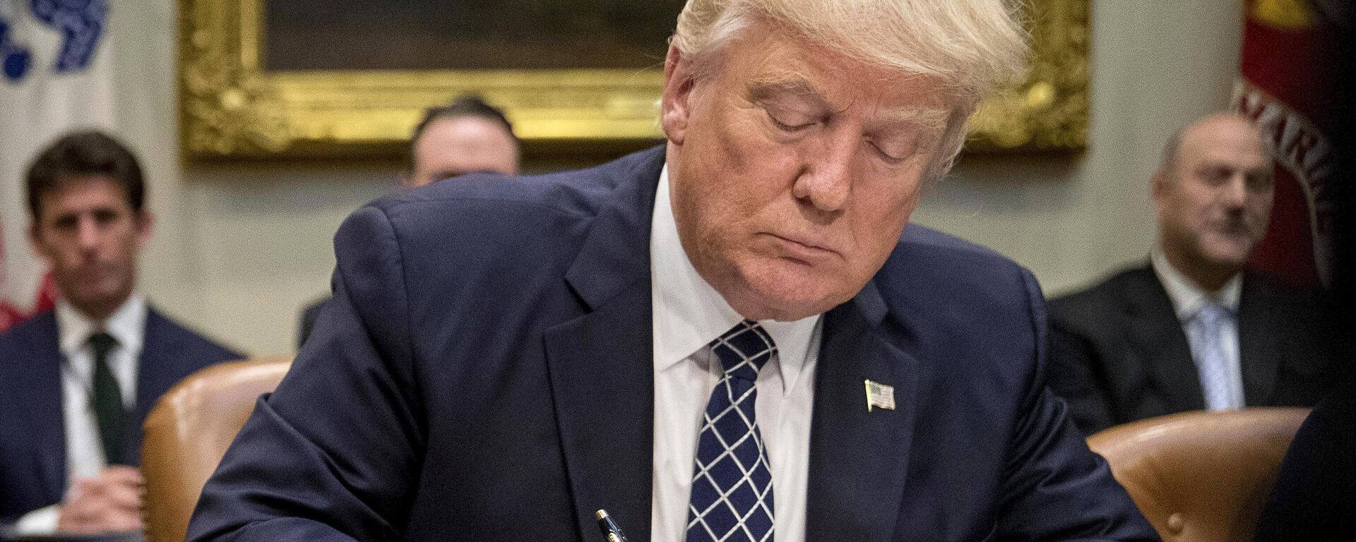  President Donald Trump signs an executive order in the Roosevelt Room of the White House in Washington, April 25, 2017. - Sputnik International, 1920, 23.03.2025