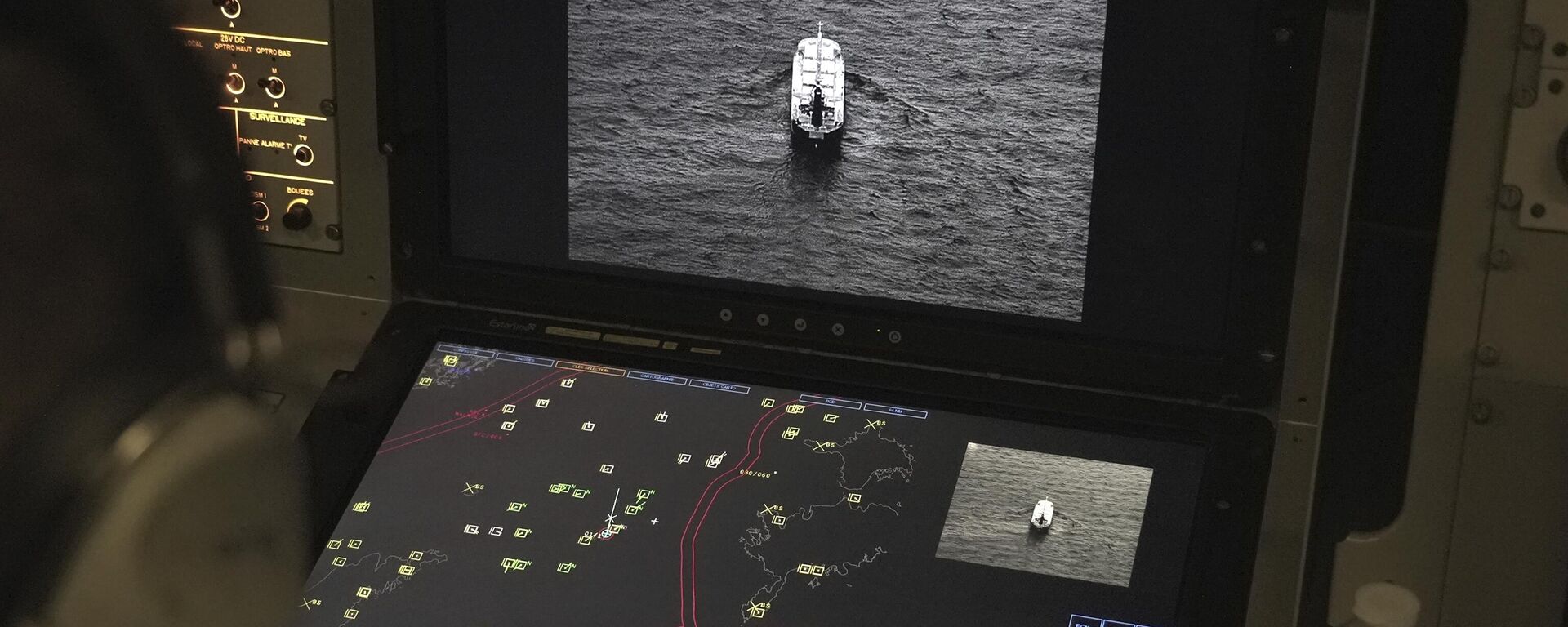 Crew members aboard a French Navy Atlantique 2 surveillance plane patrolling Thursday, Jan. 23, 2025, over the Baltic Sea as part of the NATO military alliance's Baltic Sentry mission to protect undersea cables and pipelines from sabotage watch one of the onboard monitors showing images from the aircraft's cameras of a ship navigating on the Baltic.  - Sputnik International, 1920, 27.01.2025