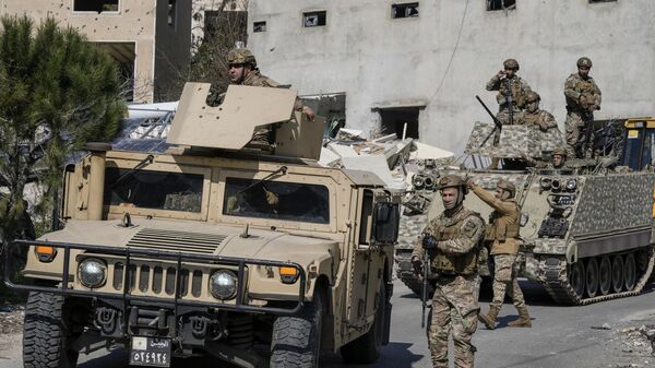 Lebanese soldiers enter a neighborhood in the southern Lebanese village of Aitaroun, Lebanon, Monday, Jan. 27, 2025.  - Sputnik International