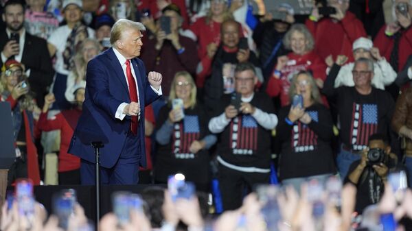 President Donald Trump dances as he departs after speaking about the economy during an event at the Circa Resort and Casino in Las Vegas, Saturday, Jan. 25, 2025. - Sputnik International