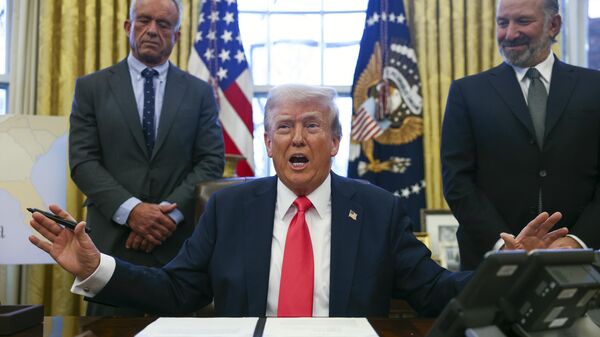 President Donald Trump speaks to reporters in the Oval Office at the White House in Washington, Tuesday, Feb. 25, 2025. - Sputnik International