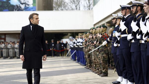 French President Emmanuel Macron reviews the troops during a military ceremony during a visit at the Digital Support and Cyber Command (CATNC) of the French Army as part of his New Year address to the Armed Forces, in Cesson-Sevigne, western France, Monday, Jan. 20, 2025.  - Sputnik International