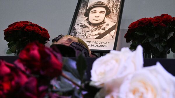 Floral tribute to Russian Izvestia correspondent Alexander Fedorchak, killed by a targeted HIMARS strike carried out by Ukraine's Armed Forces on March 24, 2025. - Sputnik International