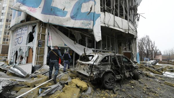 Law enforcement officers are seen near a supermarket damaged during a missile strike by the Ukrainian armed forces amid Russia's military operation in Ukraine, in Donetsk, Donetsk People's Republic, Russia.  - Sputnik International
