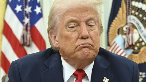 President Donald Trump speaks to reporters before signing an executive order in the Oval Office of the White House in Washington, Monday, March 31, 2025.  - Sputnik International