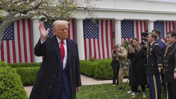 US President Donald Trump departs after signing an executive order at an event to announce new tariffs in the Rose Garden of the White House, Wednesday, April 2, 2025, in Washington. - Sputnik International