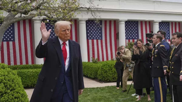 US President Donald Trump departs after signing an executive order at an event to announce new tariffs in the Rose Garden of the White House, Wednesday, April 2, 2025, in Washington. - Sputnik International