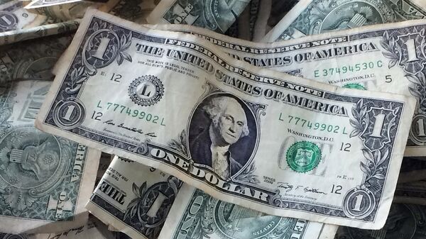 This Oct. 24, 2016 file photo shows dollar bills in New York - Sputnik International