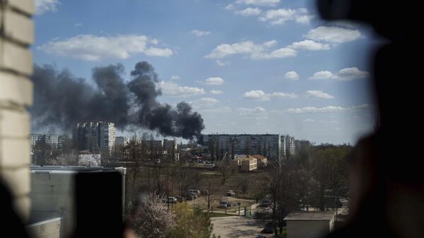 Smoke rises from an explosion following a Russian drone strike on Sumy, Ukraine, Monday, April 14, 2025. - Sputnik International