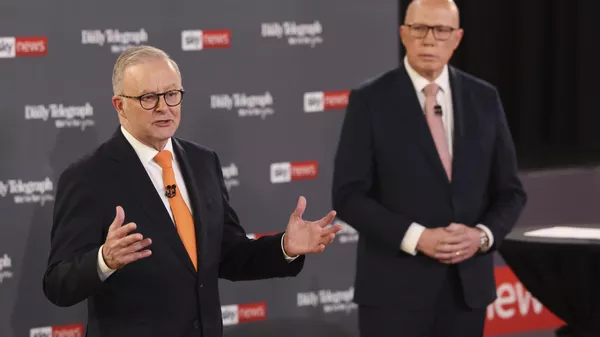 Australian Prime Minister Anthony Albanese, left, gestures as Opposition leader Peter Dutton watches during their TV debate in Sydney, Australia, Tuesday, April 8, 2025 - Sputnik International