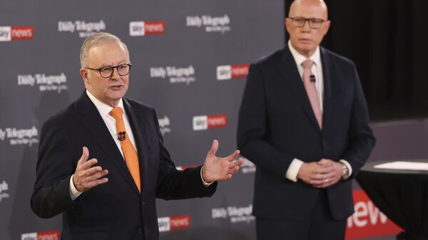 Australian Prime Minister Anthony Albanese, left, gestures as Opposition leader Peter Dutton watches during their TV debate in Sydney, Australia, Tuesday, April 8, 2025 - Sputnik International