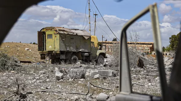 Debris is scattered at the site of an Israeli strike on a military airbase near Hama, Syria, Thursday, April 3, 2025.  - Sputnik International
