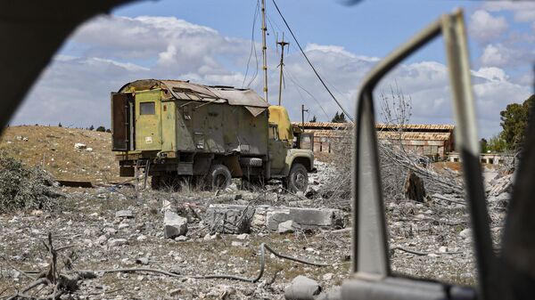 Debris is scattered at the site of an Israeli strike on a military airbase near Hama, Syria, Thursday, April 3, 2025.  - Sputnik International