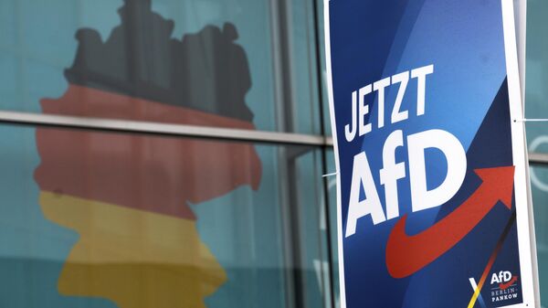FILE —An election poster of the German far right Alternative for Germany party (AfD), right, is attached to a lamppost in front of a giant election poster showing a map of Germany, at the headquarters of the German Christian Democratic Union (CDU) in Berlin, Germany, Jan. 29, 2025. Slogan reads: 'Now AfD'.  - Sputnik International