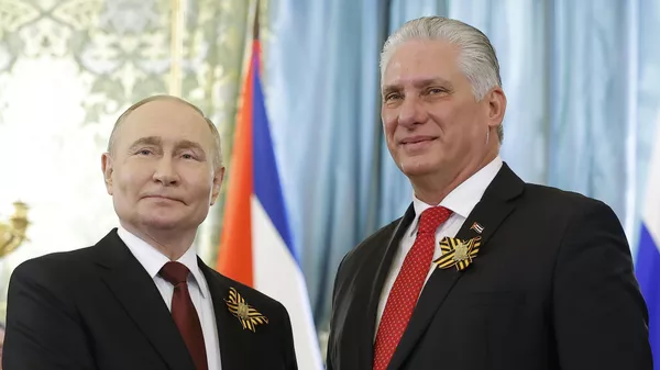 Russian President Vladimir Putin, left, and Cuban President Miguel Diaz-Canel pose for a photo during their meeting at the Great Kremlin Palace at the Kremlin in Moscow, Russia, on Thursday, May 9, 2024 - Sputnik International