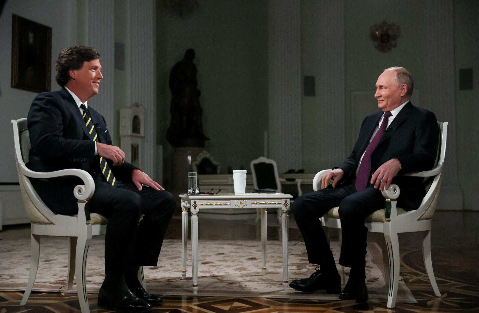 Russian President Vladimir Putin and US journalist Tucker Carlson. File photo Russian President Vladimir Putin and US journalist Tucker Carlson. File photo - Sputnik International, 1920, 07.05.2025