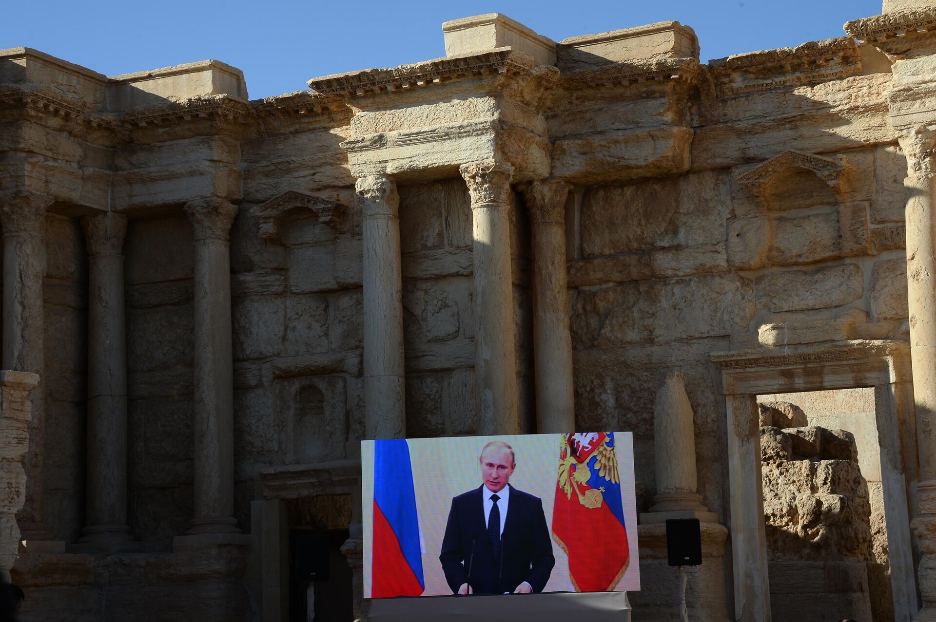 Broadcast of an address by Russian President Vladimir Putin in the Roman Amphitheater of Syrian Palmyra, liberated from the terrorists of the ISIS* Broadcast of an address by Russian President Vladimir Putin in the Roman Amphitheater of Syrian Palmyra, liberated from the terrorists of the ISIS* - Sputnik International, 1920, 07.05.2025