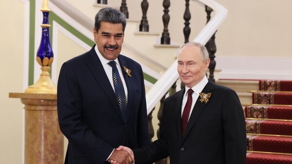 Russian President Vladimir Putin and Venezuelan President Nicolas Maduro (left) during a meeting in the Kremlin before the military parade dedicated to the 80th anniversary of Victory on May 9. - Sputnik International