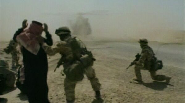 In this image taken from video, a British soldier directs an Iraqi to kneel, while an RAF Puma helicopter lands, Thursday, April 3, 2003, during patrols around Nasiriyah, Iraq.  - Sputnik International