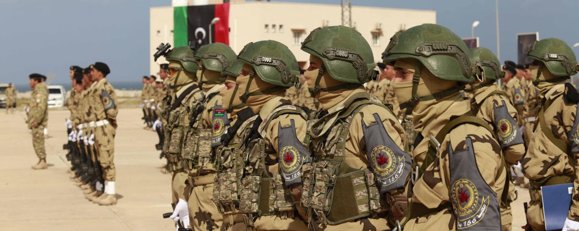 Libyan army cadets stand at attention for an audience including the prime minister, the commander of the Turkish training mission, and other dignitaries at their graduation ceremony of  in Tripoli, Libya, Tuesday, Feb. 8, 2022 - Sputnik International, 1920, 13.05.2025