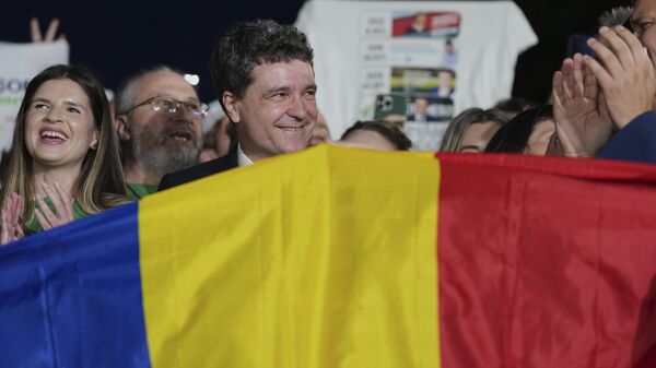 Presidential candidate Nicusor Dan speaks to media after polls closed for the second round of the country's presidential election redo in Bucharest, Romania, Sunday, May 18, 2025.  - Sputnik International