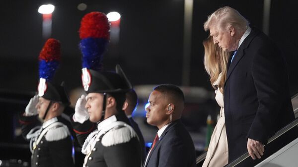 President Donald Trump and first lady Melania Trump arrive at Leonardo da Vinci International Airport to attend the funeral of Pope Francis, Friday, April 25, 2025, in Rome. - Sputnik International
