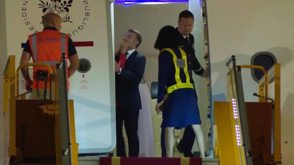 In this grab taken from video, France's President Emmanuel Macron prepares to disembark a plane on arrival, in Hanoi, Vietnam. - Sputnik International