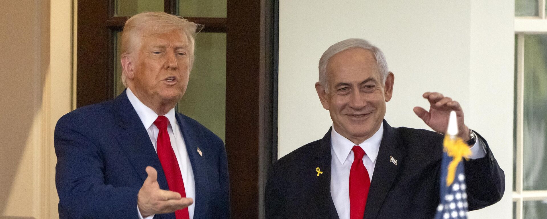 President Donald Trump, left, and Israel's Prime Minister Benjamin Netanyahu wave as Netanyahu leaves the West Wing of the White House, Monday, April 7, 2025, in Washington.  - Sputnik International, 1920, 14.06.2025