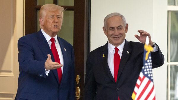 President Donald Trump, left, and Israel's Prime Minister Benjamin Netanyahu wave as Netanyahu leaves the West Wing of the White House, Monday, April 7, 2025, in Washington.  - Sputnik International