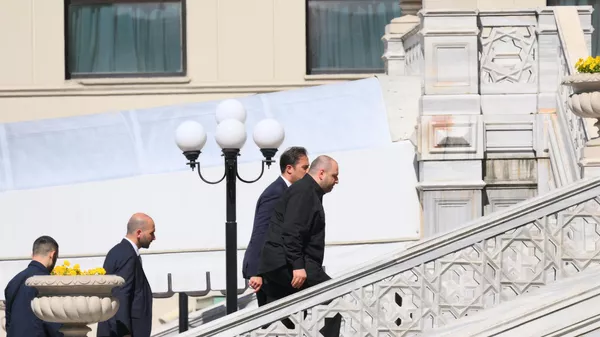 Members of the Ukrainian delegation walk up the stairs at the venue of the second round of the 2025 Istanbul peace talks in Turkiye, led by Ukrainian Defense Minister Rustem Umerov. - Sputnik International