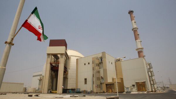 An Iranian flag flutters in front of the reactor building of the Bushehr nuclear power plant, just outside the southern city of Bushehr, Iran, Saturday, Aug. 21, 2010. - Sputnik International