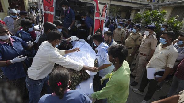 Remains of victims are brought to Civil Hospital after an airplane crashed in India's northwestern city of Ahmedabad in Gujarat state, Thursday, June 12, 2025. - Sputnik International